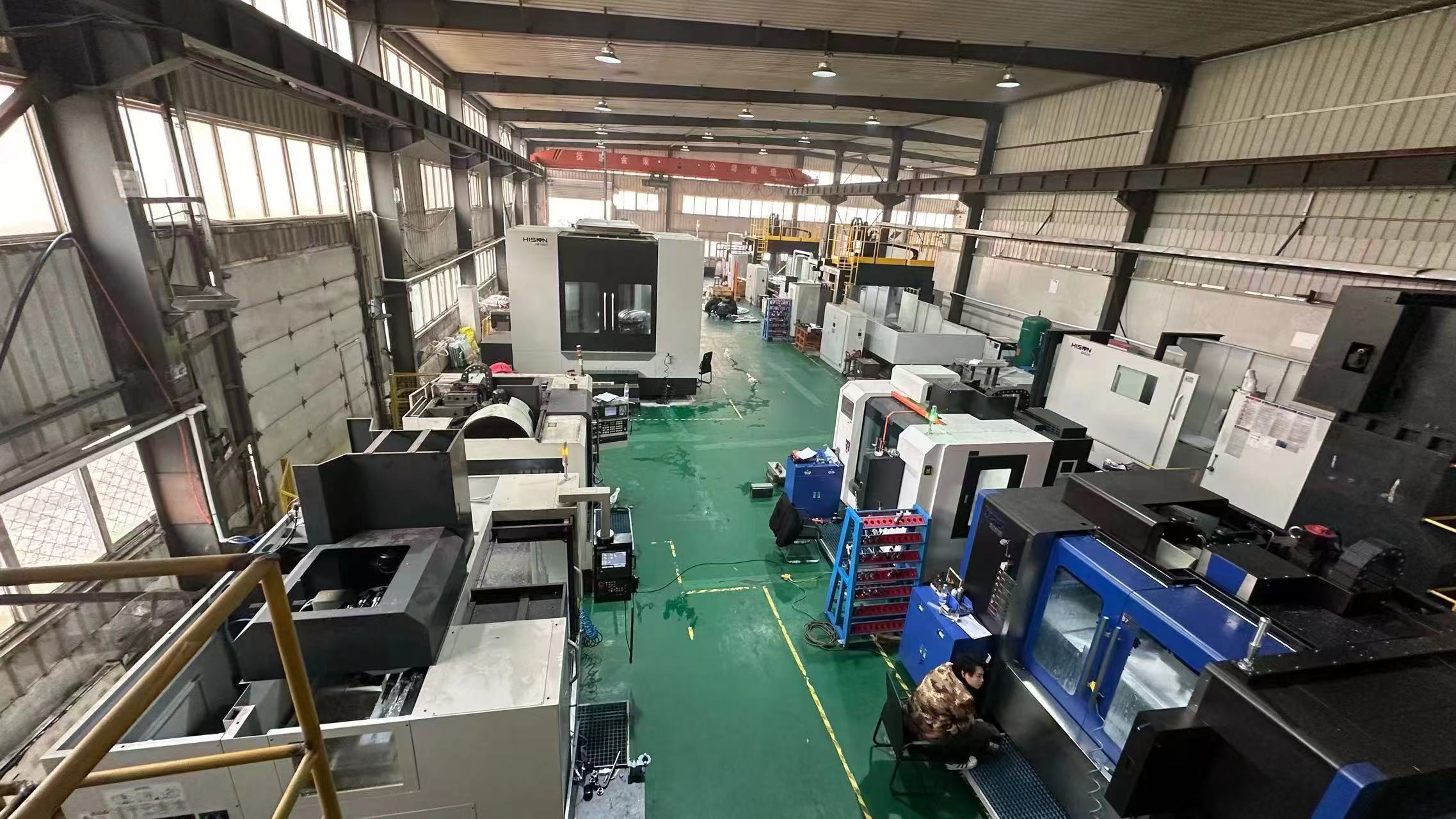Wide view of the active CNC production floor