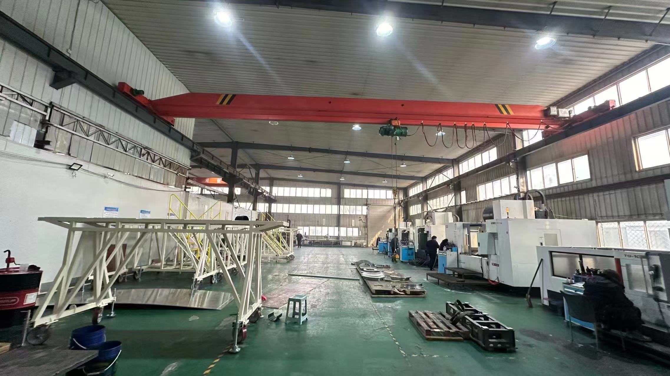 Large workshop with machining equipment and fabricated assemblies
